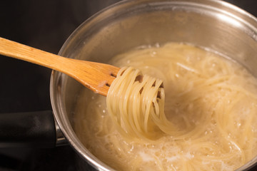 pasta is cooked in a pot