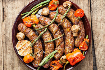 Sausages fried with vegetable
