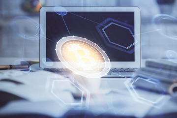 Multi exposure of blockchain and crypto economy theme hologram and table with computer background....