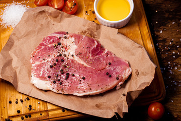 meat steak with spices and tomatoes