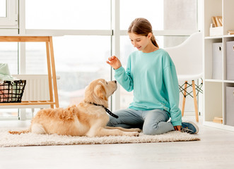 Beautiful girl training lovely dog