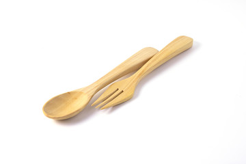 Cutlery made from wah wood on a white background.
