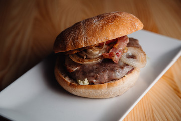 sea fruits with ketchup in a white plate on a wooden table