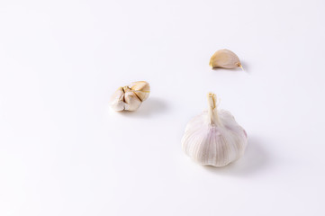 Garlic is a spice for cooking. On a white background.
