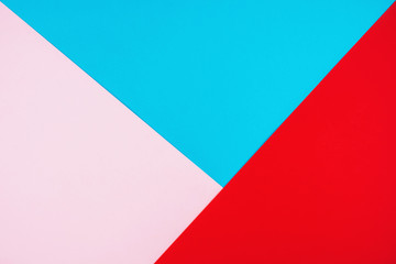 Three-color background in bright colors. Pastel colors of blue, pink and red.