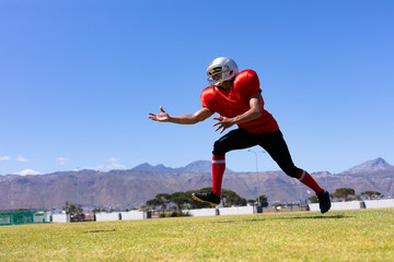 Naklejka premium Football player playing football