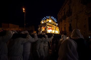 Christian brethren during the traditional Good Friday procession, Leonforte