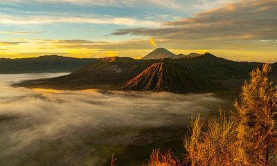 Mount Bromo in Java Indonesia during sunrise early in the morning with beautiful colours and fog