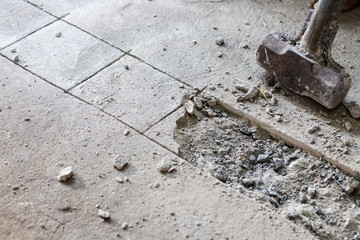 A large hammer bashed into the concrete.