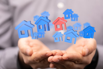 Fototapeta premium house in among houses for real estate concept.