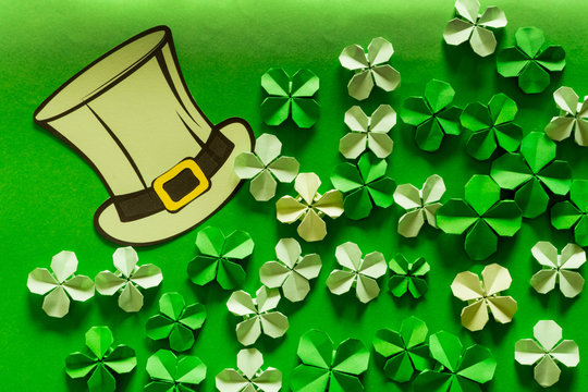Saint Patrick's day background with hat and paper clovers