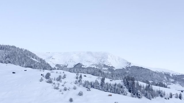 Drone flying in morning light in winterwonderland serfaus