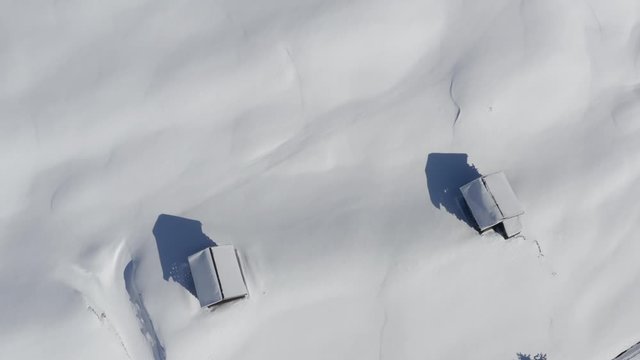 Winterwonderland serfaus drone flying over mountain huts