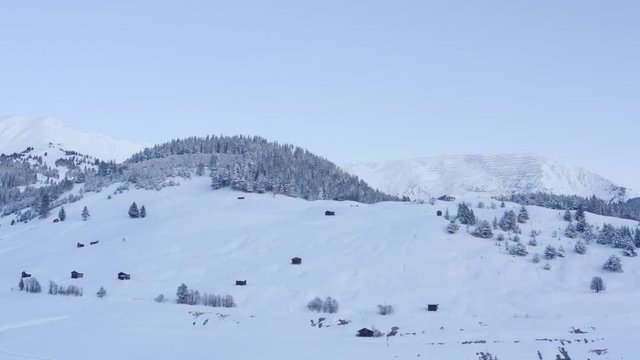 Drone flying in morning light in winterwonderland serfaus
