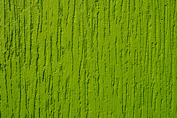 Decorative plaster texture background painted in green. Green wall background.