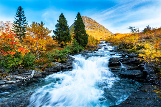 Beautiful Autumn Landscape With Yellow Trees And Waterfall