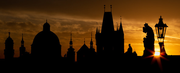 Praghe - The Charles bridge silhouette at the sunrise.