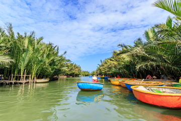 Naklejka na ściany i meble バスケットボートとニッパヤシのジャングル　ベトナム　ホイアン　Basket boat and Nippa palm jungle