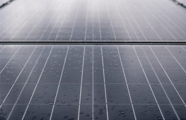 Solar panel with rain drops on it. Solar panel in rain.