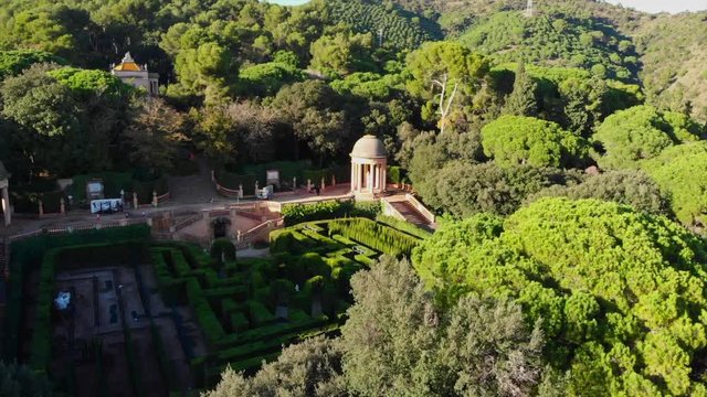 drone video of the romantic plant labyrinth in Barcelona flying high and and away evealing the whole labyrinth with his views