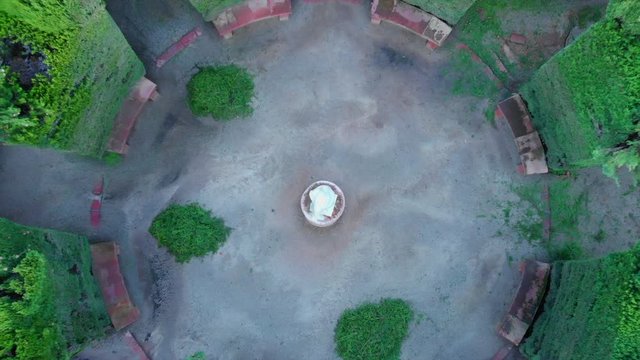 drone video of the romantic plant labyrinth in Barcelona flying high and revealing the whole labyrinth in a birds eye view