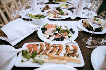 Plate of appetizers  on the table at a restaurant at a party. Food on table