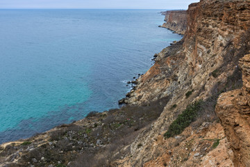 Fototapeta na wymiar Beach with clear turquoise sea water in the Black sea