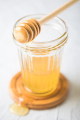 Natural flower honey in a glass jar