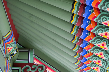 Beautiful traditional pattern of Korean style roof. Korean architecture - colorful wooden roof with traditional ornament.