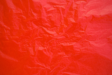 Obraz premium Red crumpled paper texture background 