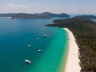 Tropical beach paradise. Whitsundays aerial view, with turquoise ocean, white sand. Dramatic DRONE from above. Travel, holiday, vacation, paradise concepts. Whitsundays Islands, Queenstown, Australia.