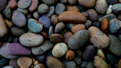 Fototapeta na wymiar pebbles on the beach stone background. color stone