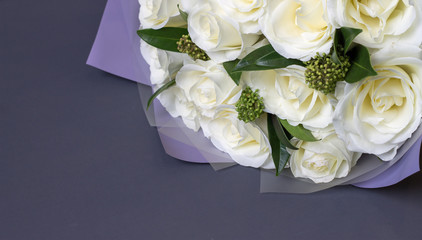 bouquet of white roses on a gray background copy space