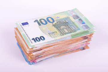 Pile of Euro banknotes isolated on the white background