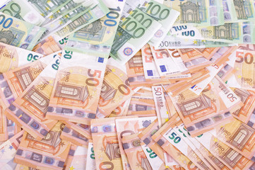 Many euro banknotes spread all over