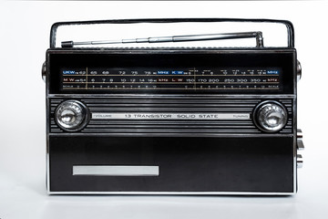 Old radio on white background. Radio antenna. Broadcast object. Minimalism background. Radio broadcasting. Musical record. Retro music. Vintage decorative element.