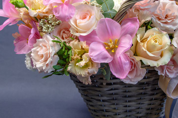 composition of fresh flowers close-up on a gray background