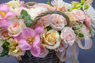 composition of fresh flowers close-up on a gray background