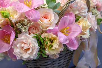 composition of fresh flowers close-up on a gray background