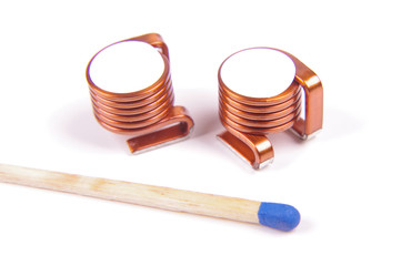 High power SMD coil in comparison with match head