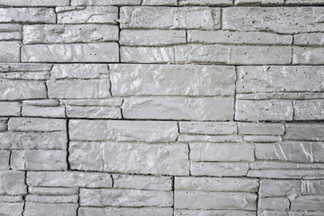 The texture of the brick wall is gray. Brick background