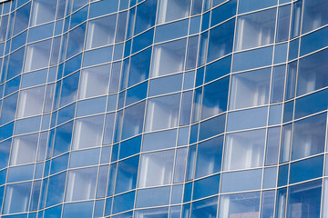 Beautiful architectural structures. Buildings of glass Windows. Background of glass Windows