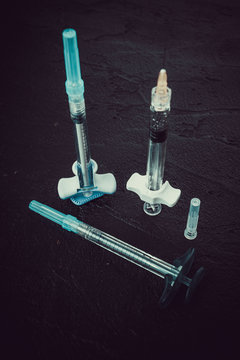 A set of different syringes on lack. Face Cosmetics Injecting