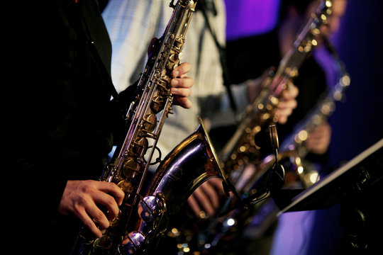 Jazz saxophone performance on the stage detail