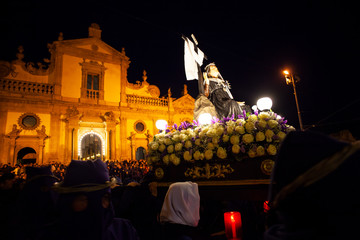 Christian brethren during the traditional Good Friday procession, Leonforte