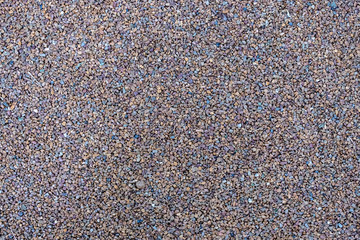 Floor coating composed of small pebbles agglutinated. Pebble floor decorative coating.