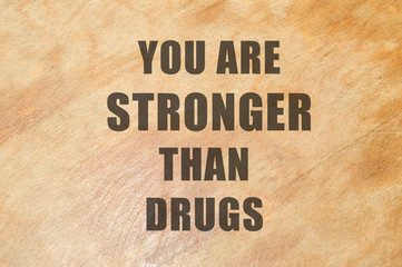 You are stronger than drugs written on wooden background