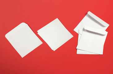 White envelope and post card on background. Top view blank envelope mockup and blank letterhead...
