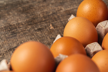Close up of fresh chicken egg on nature wooden table
