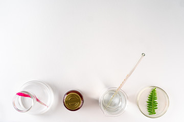 Making herbal dietary supplement in lab with plant leaves. Health and beauty concept